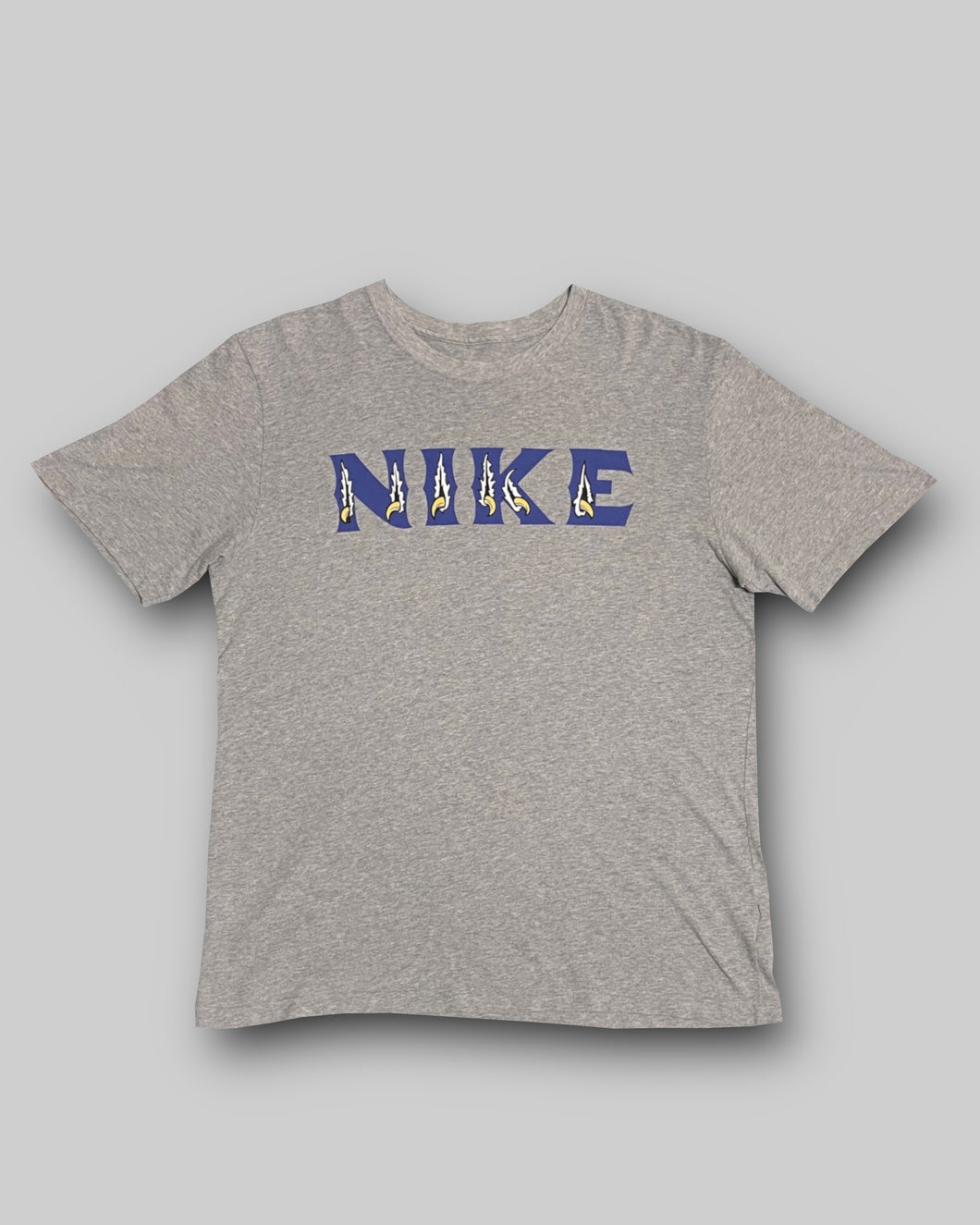 2012’S Nike torn logo grey tee